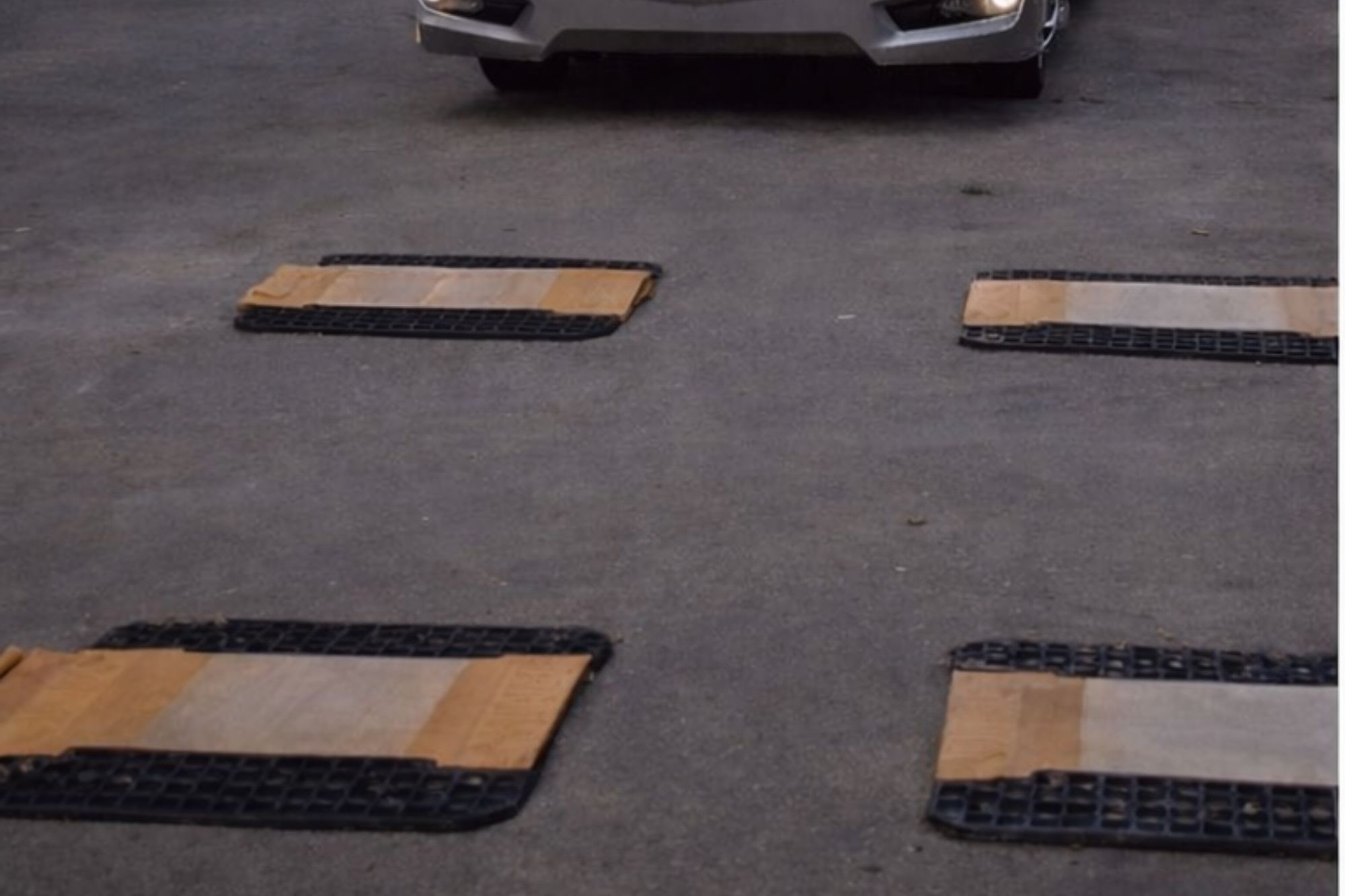 RV positioned on individual wheel scales for four-corner weighing